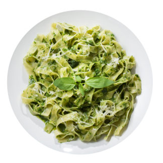 Plate,of,pasta,with,pesto,sauce,isolated,on,a,white