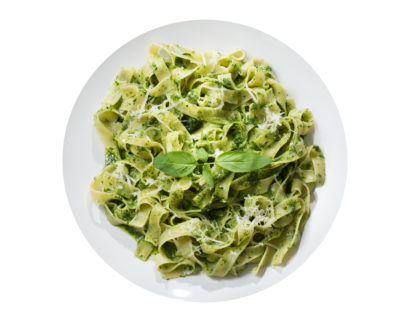 Plate,of,pasta,with,pesto,sauce,isolated,on,a,white